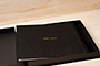 AsukaBook Zen Layflat Impact Photo Book Black faux leather book inside the presentation box