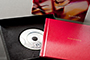 AsukaBook Zen Layflat Impact Photo Book with retro red cover and inside of box and front cover of box