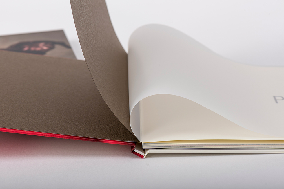 AsukaBook Art Layflat Photo Book Brown inside of front cover, brown paper first page, and vellum sheet